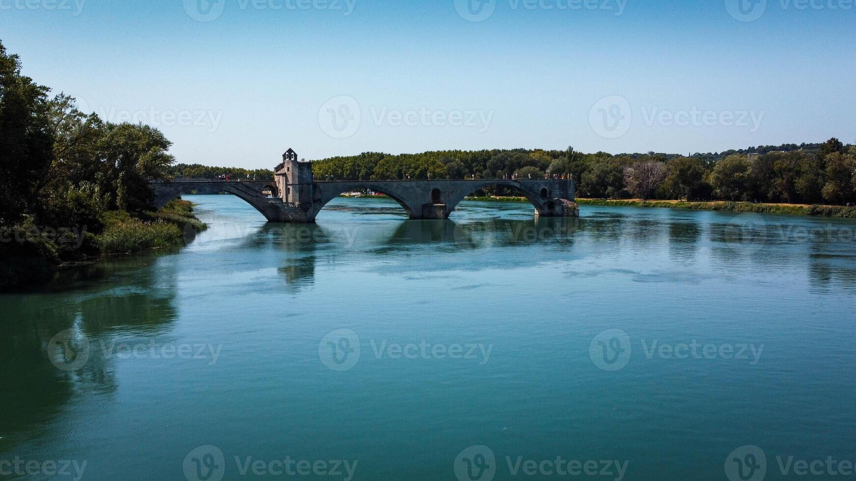 Broken bridge Saint-Benezet in the city of Avignon in Provence. famous Avignon bridge over the Rhone depicted in paintings, poems, stamps. architecture seen from a drone with its arches. photo