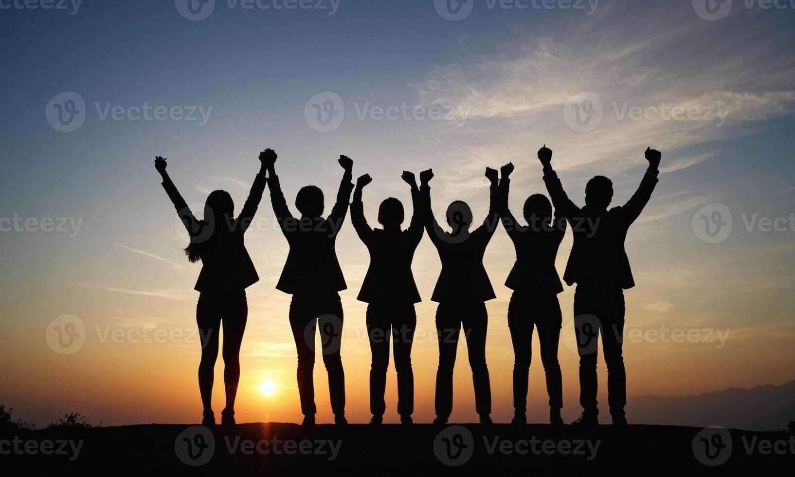Silhouette of business team stand and feel happy on the most high at stand on sunset photo