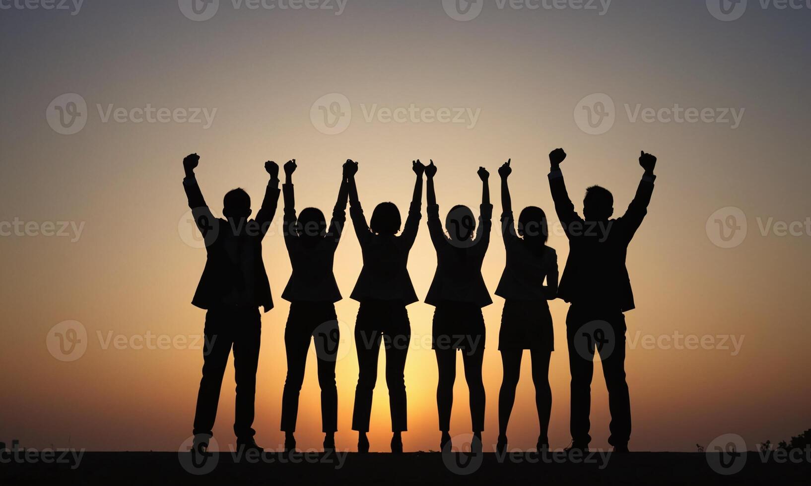 Silhouette of business team stand and feel happy on the most high at stand on sunset photo