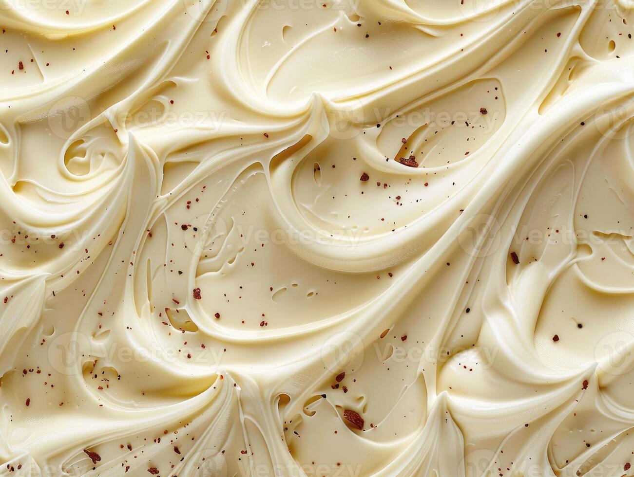 Creamy White Frosting Swirled with Dark Chocolate Sprinkles photo