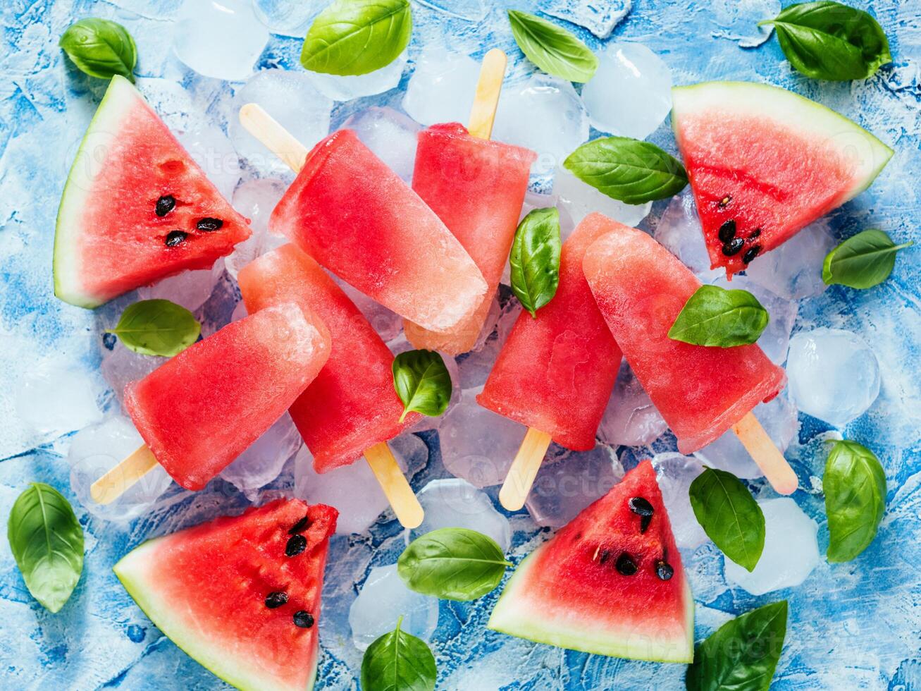 Top view of watermelon and basil popsicles photo