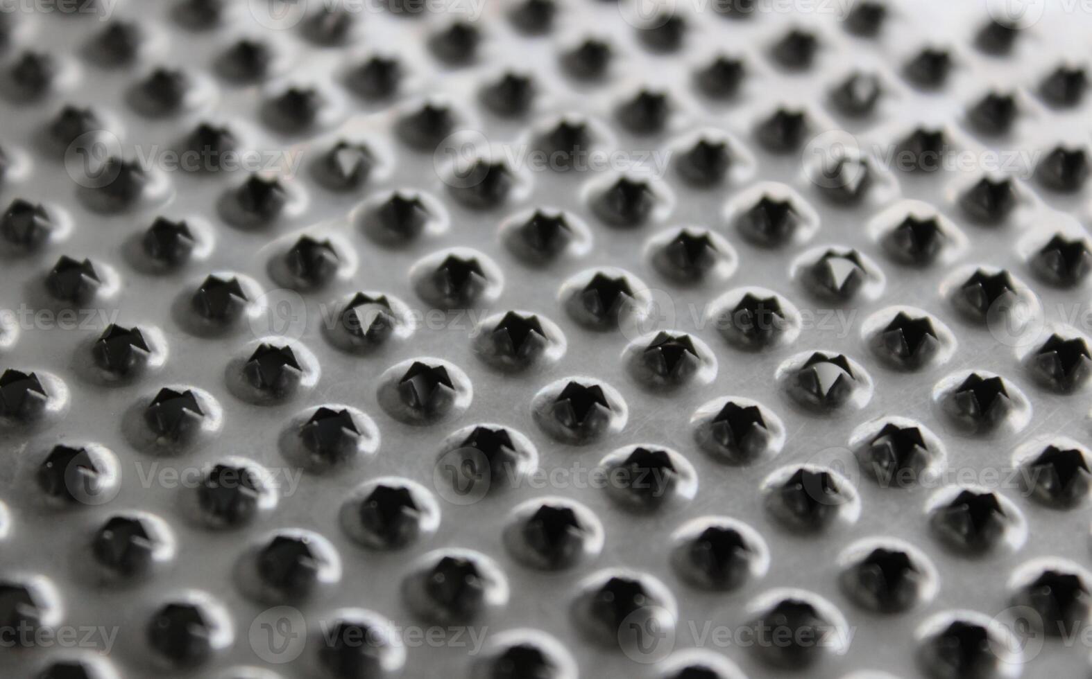 Pattern Of Perforated Metal Food Grater Surface Detailed Photo