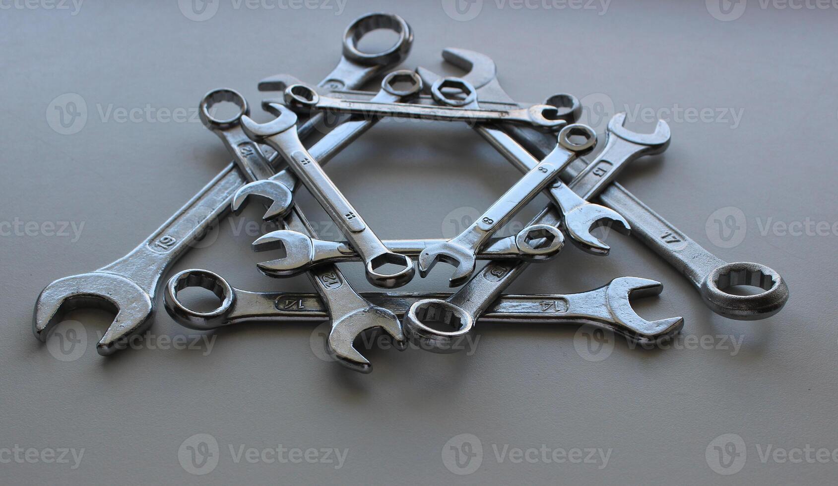 Angle View Of Arrangement In Triangle Form On White Different Combination Spanners photo