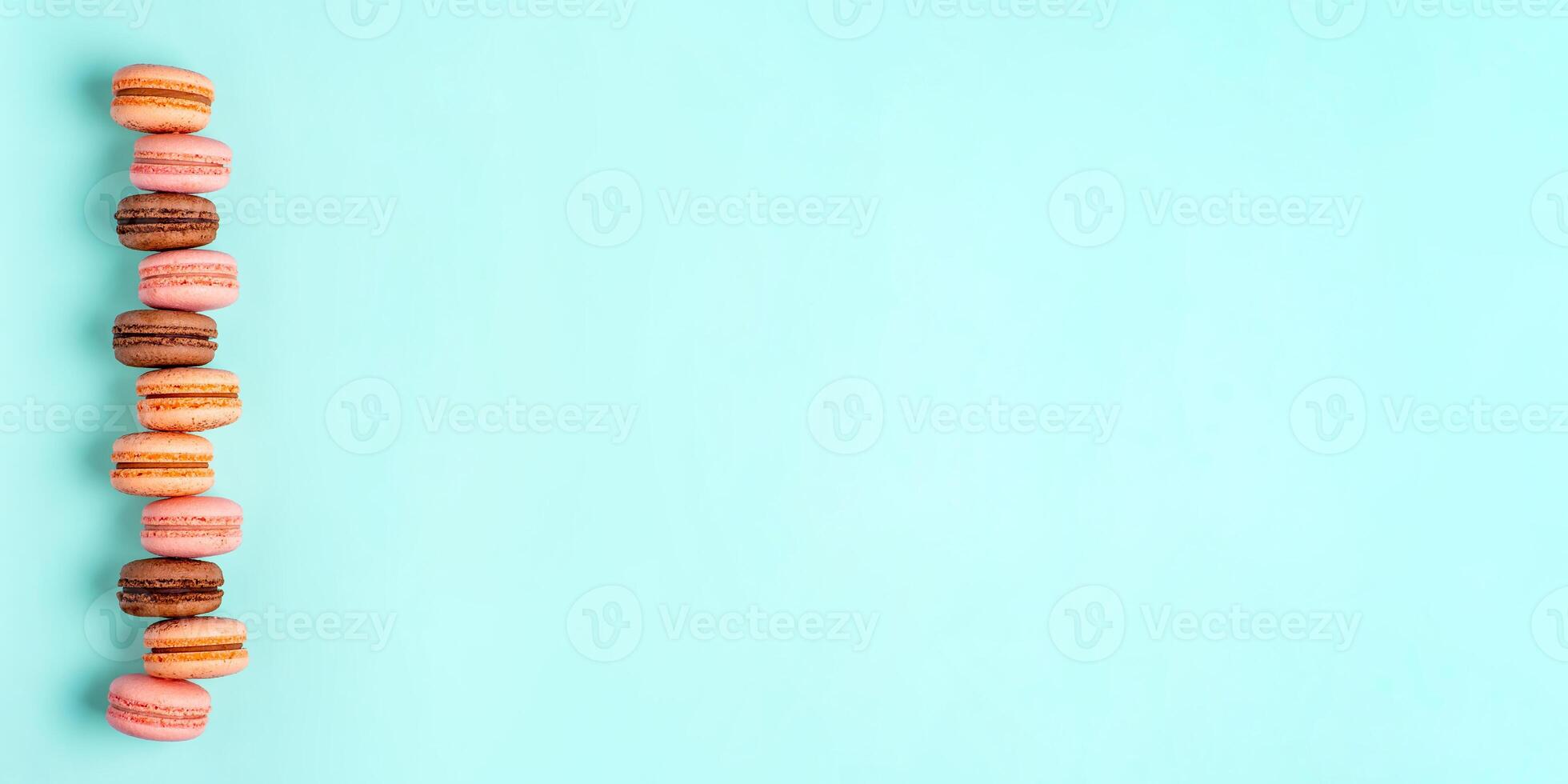 Macarons on blue, banner with copy space photo