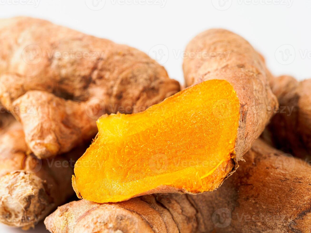 Turmeric root close up, white background photo