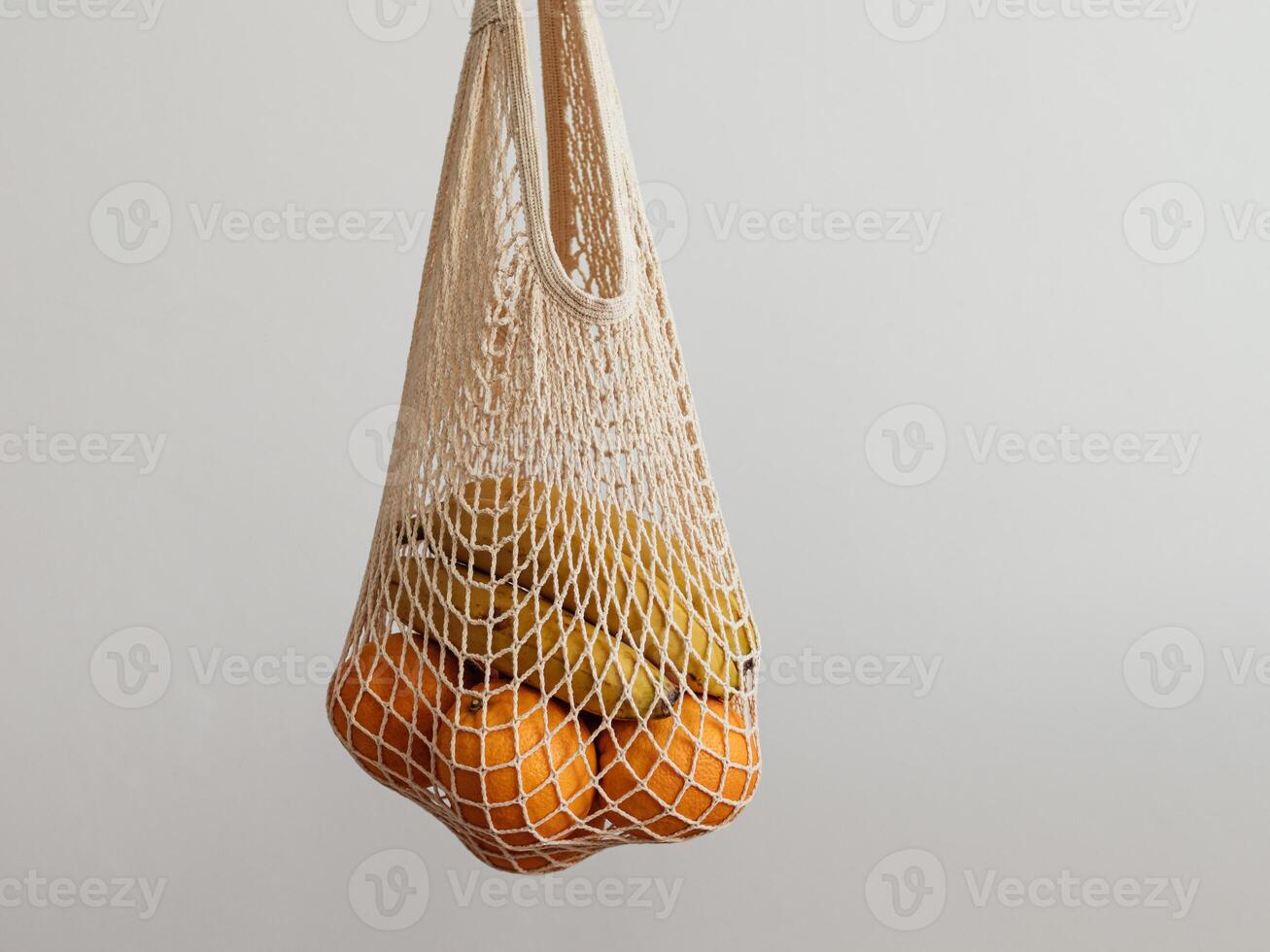 woman hand hold mesh bag. Zero waste concept photo