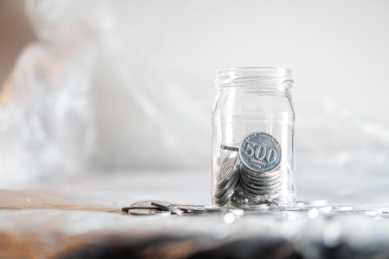 Jar filled with 500 Korean won coins photo