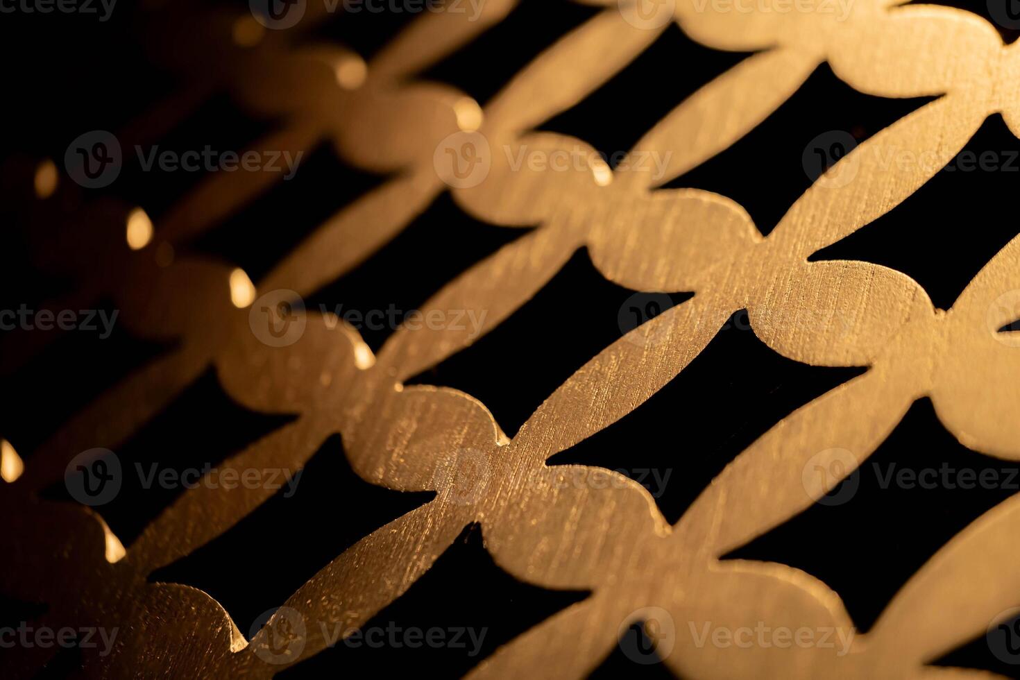 Golden metallic interlocking pattern close-up photo