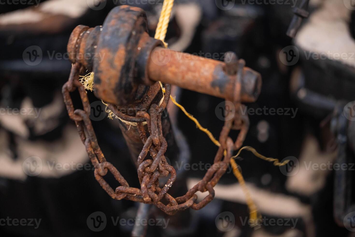 Rusty chain and metal rod close-up photo