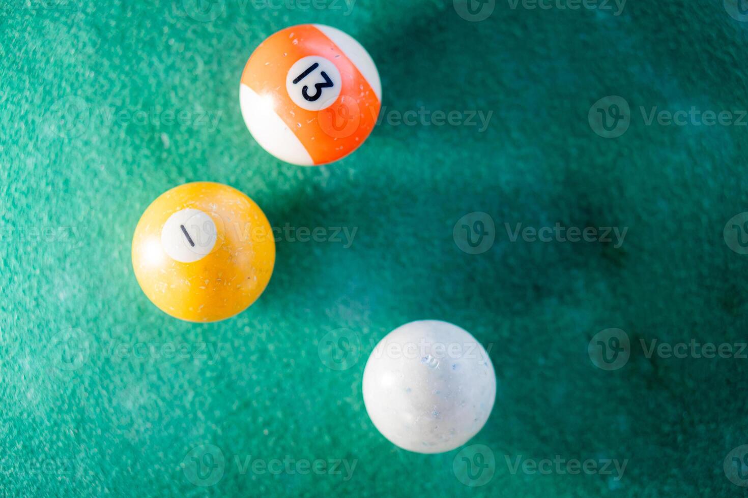 Billiard balls on a green pool table photo