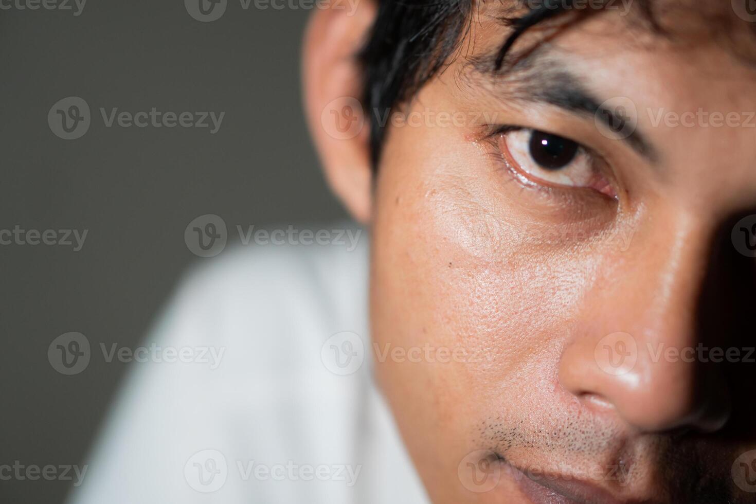 Close-up of a man's serious expression photo