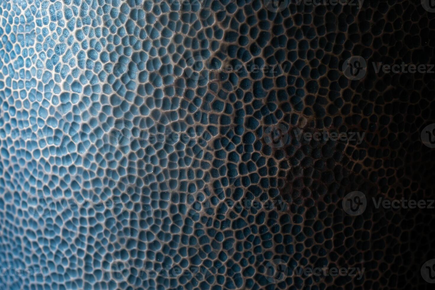 Textured blue surface resembling reptile skin photo