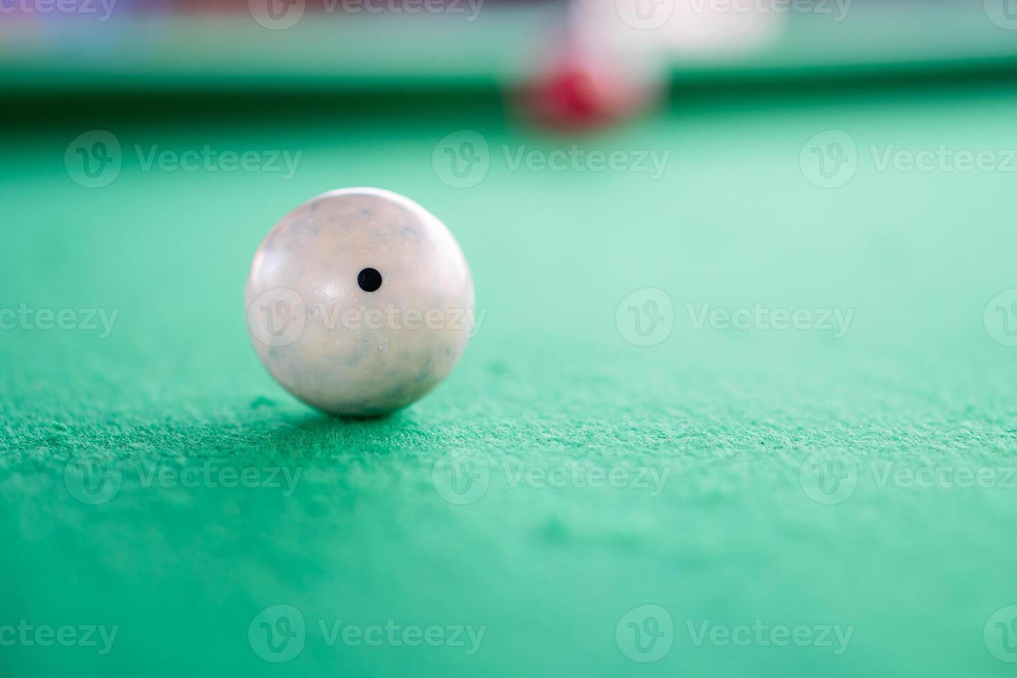 Cue ball on green billiard table photo