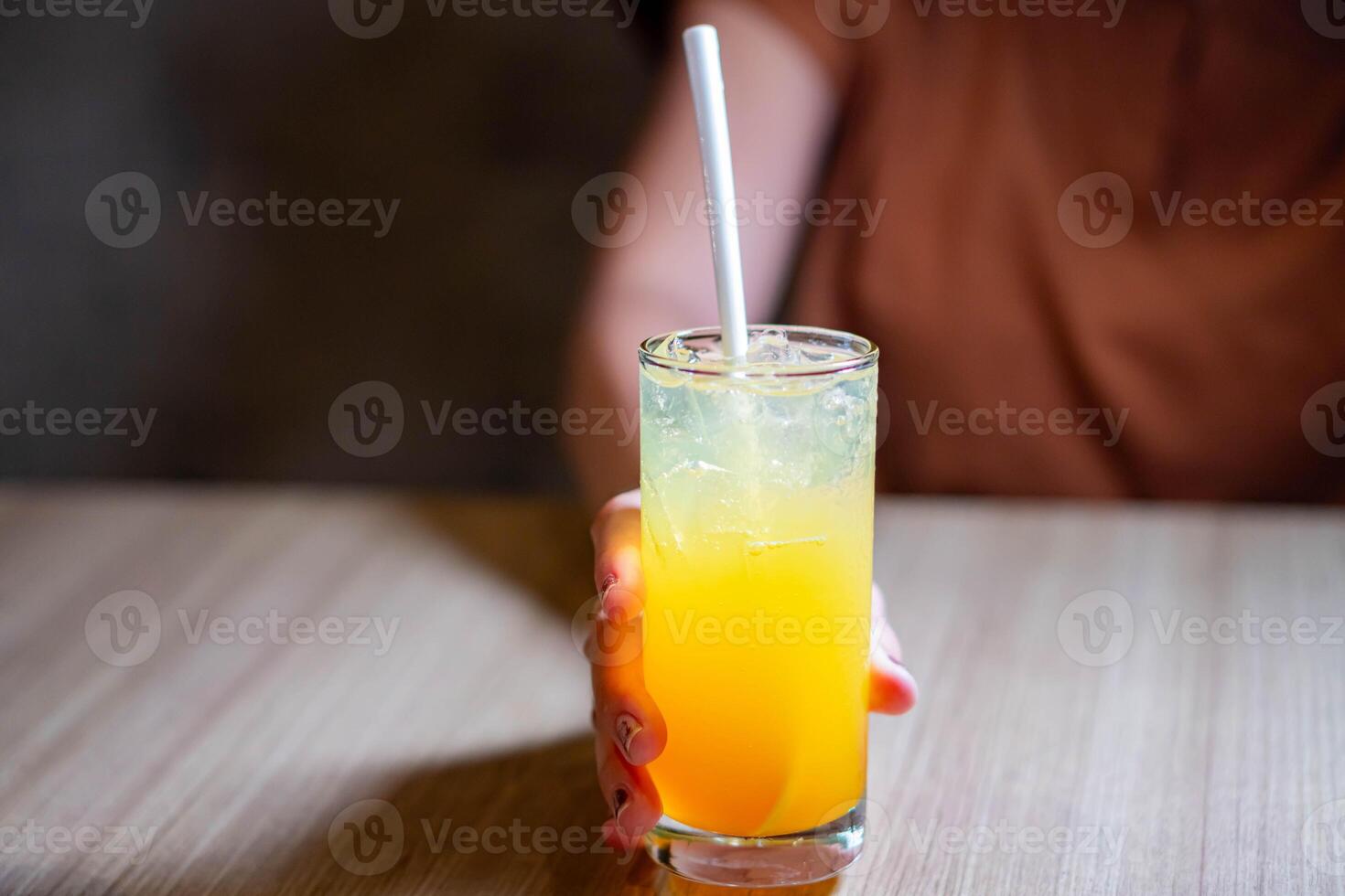 Fresh orange juice with a straw photo