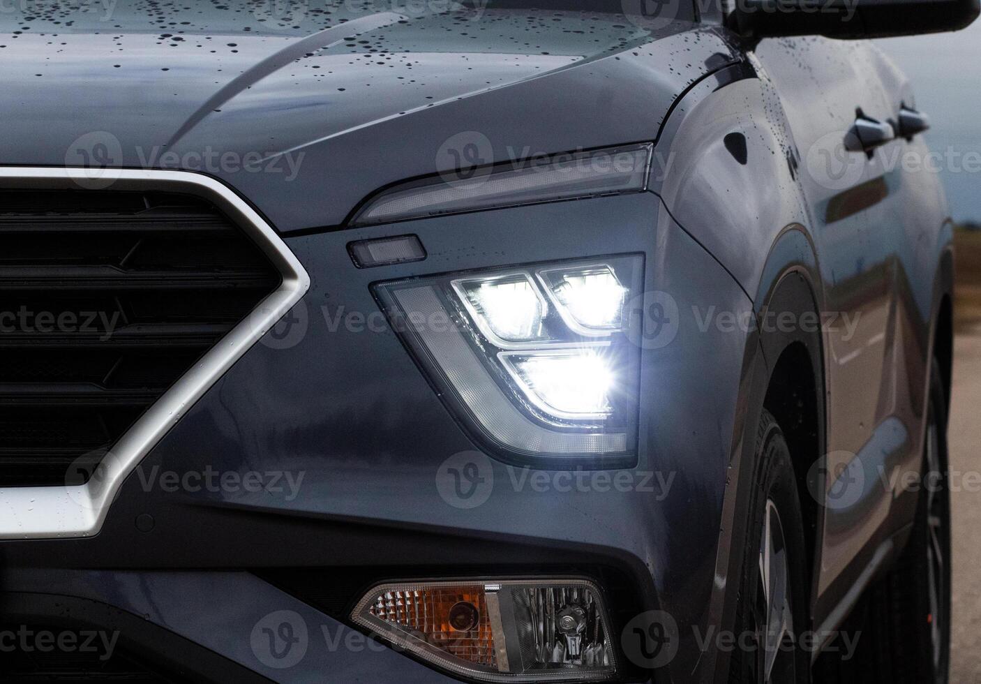 Exterior of a new car. Front LED low beam and high beam headlights photo