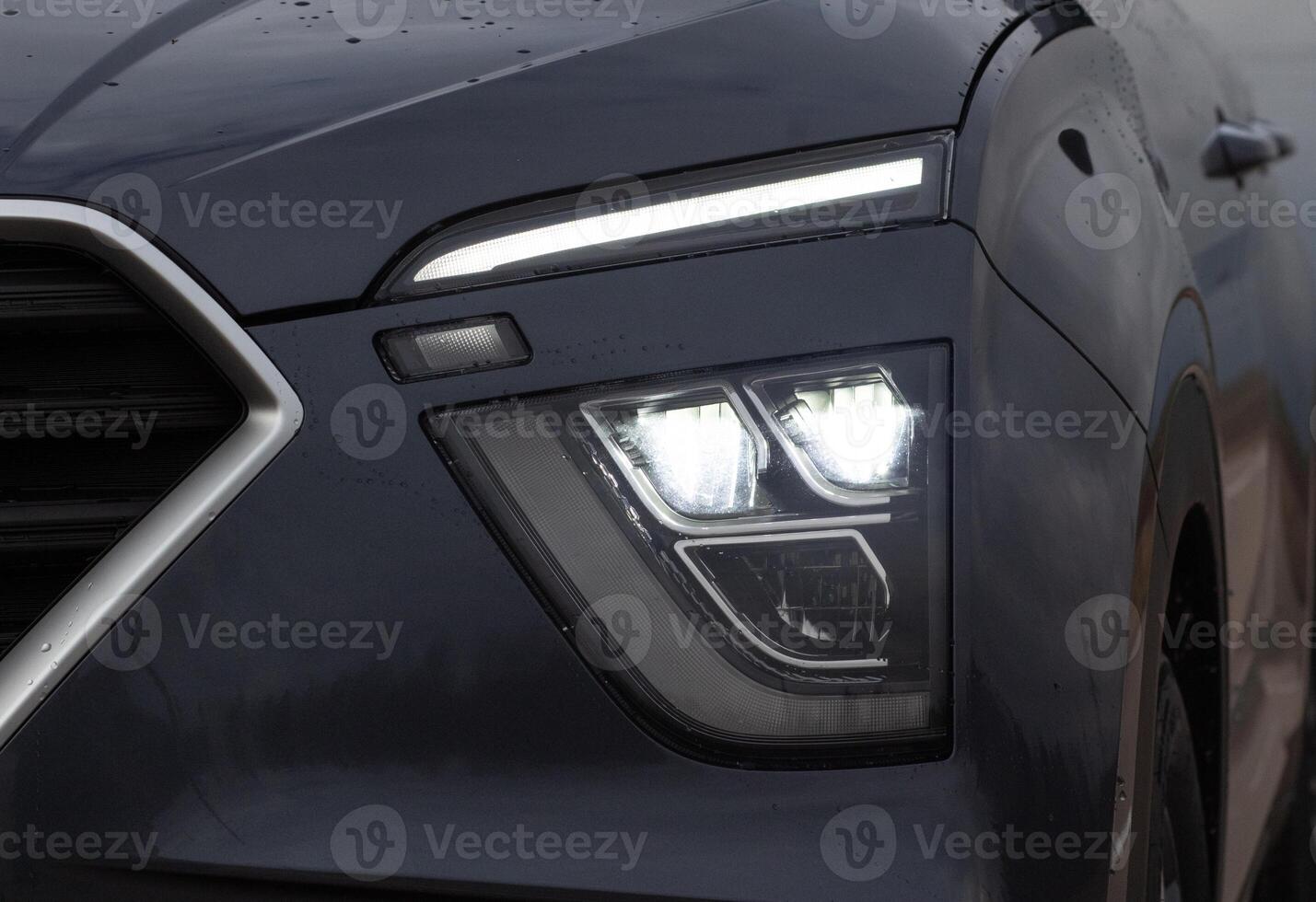 Exterior of a new car. Front LED low beam and high beam headlights photo