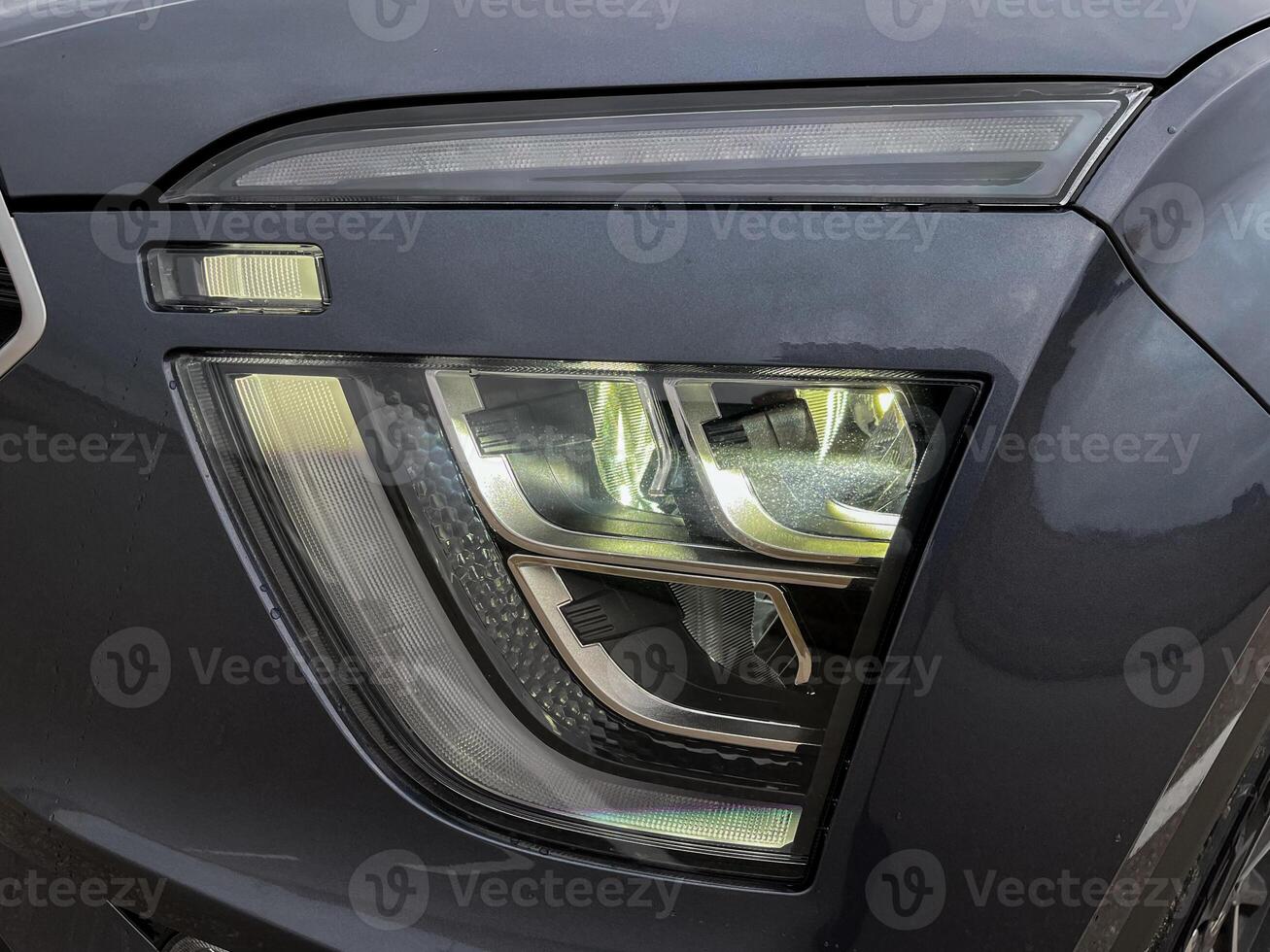 Exterior of a new car. Front LED low beam and high beam headlights photo