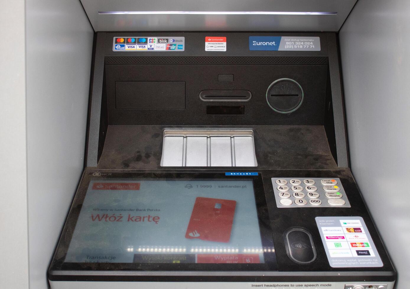 Poznan, Poland - 04.14.2024 Santander ATM installed on the street close-up photo
