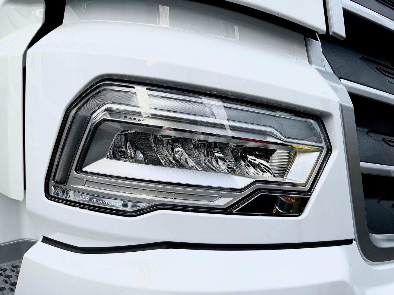 Poznan, Poland - 01.03.2023 Appearance of a new car. Front LED low beam and high beam headlights of the new DAF XF truck photo