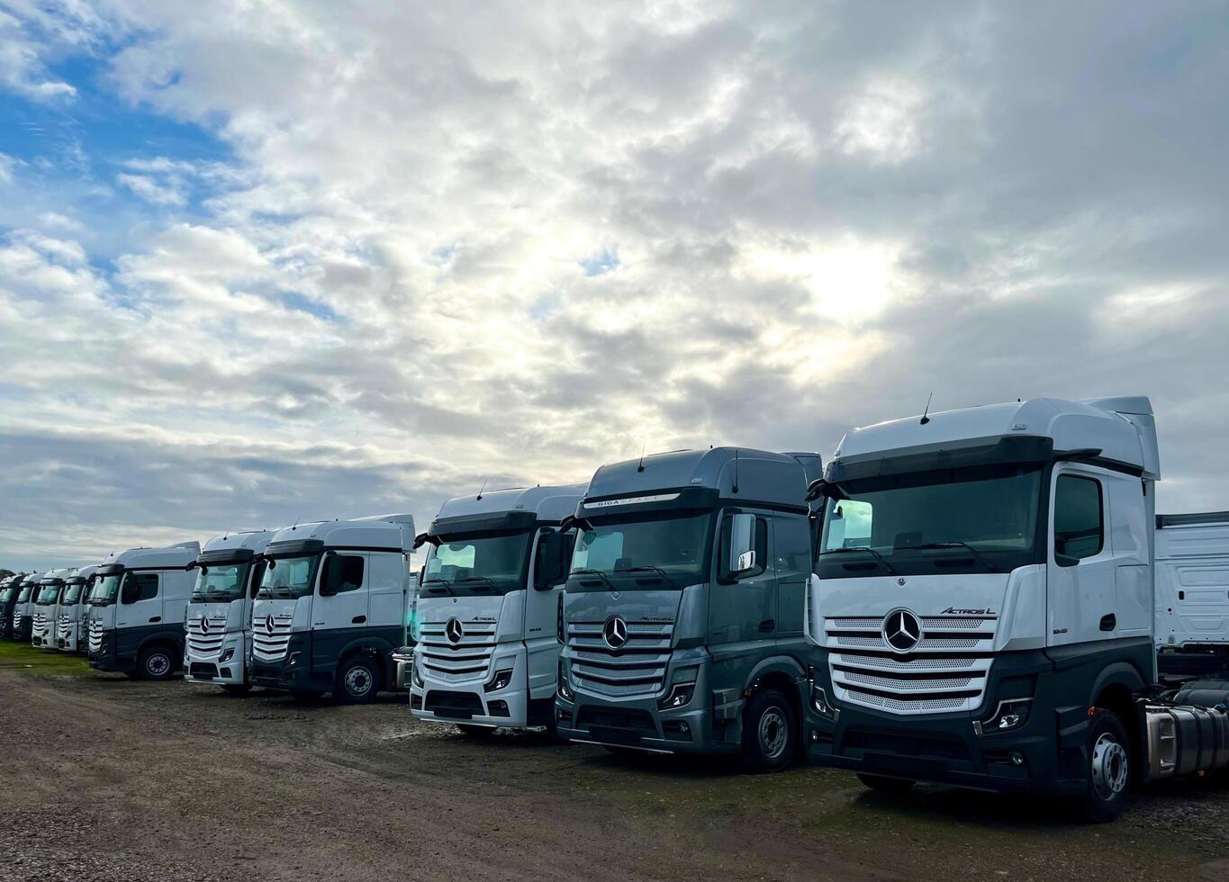 Poznan, Poland 01.03.2023 Warehouse with new Mercedes Actros L stored in the open air photo