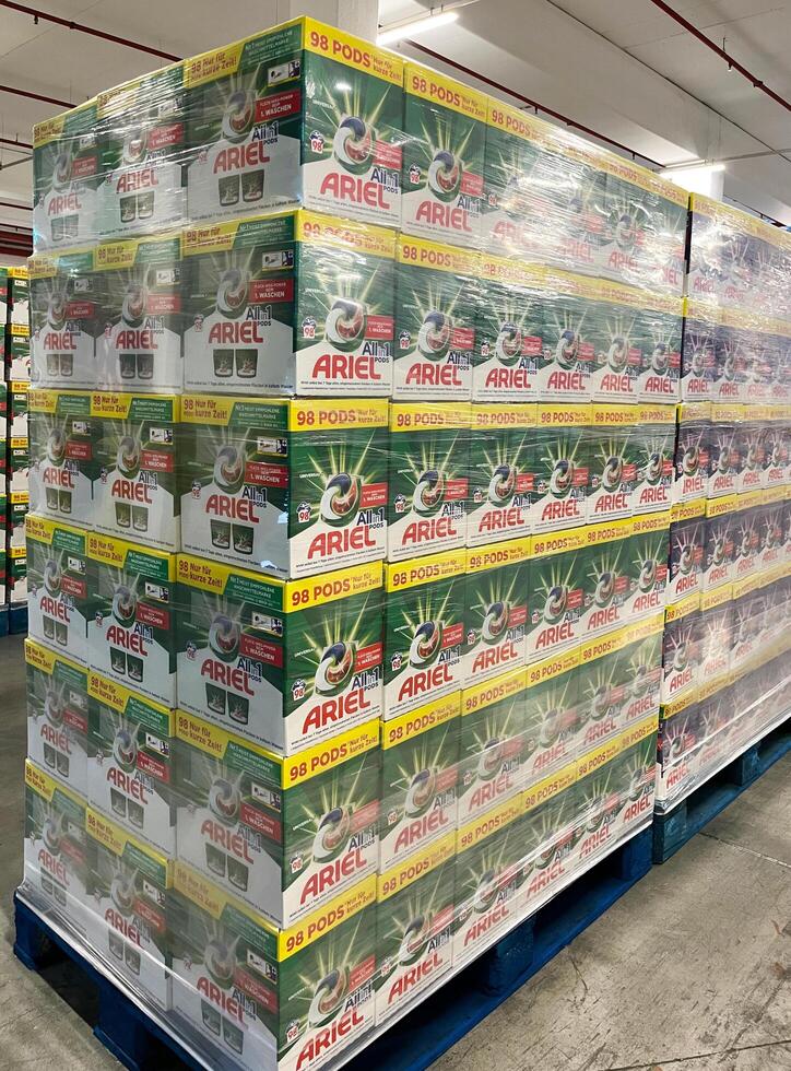 Germany - 03.25.2023 Ariel liquid powder capsules are in packages. Many packages with powder are prepared for transportation photo