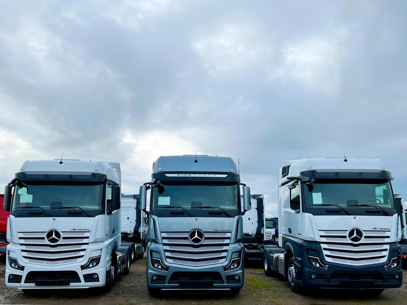 Poznan, Poland 01.03.2023 Warehouse with new Mercedes Actros L stored in the open air photo