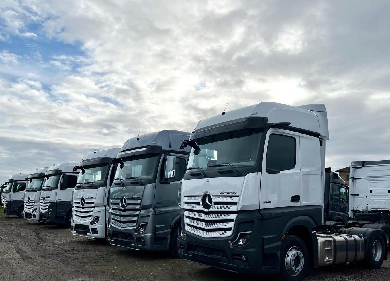 Poznan, Poland 01.03.2023 Warehouse with new Mercedes Actros L stored in the open air photo