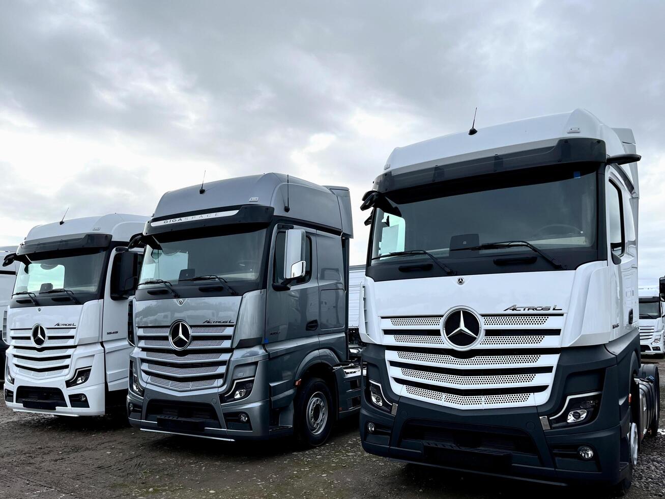 Poznan, Poland 01.03.2023 Warehouse with new Mercedes Actros L stored in the open air photo