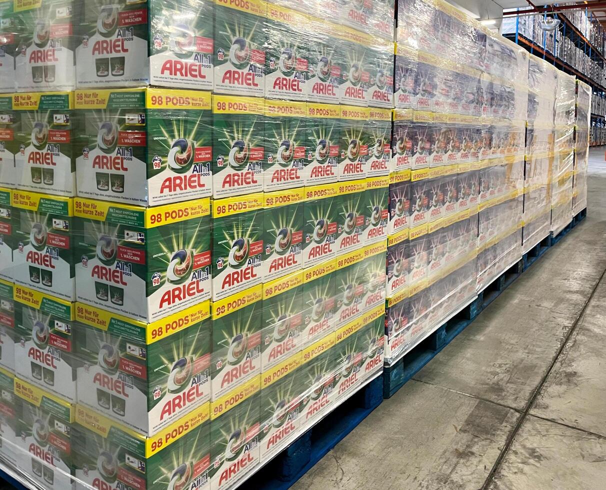 Germany - 03.25.2023 Ariel liquid powder capsules are in packages. Many packages with powder are prepared for transportation photo