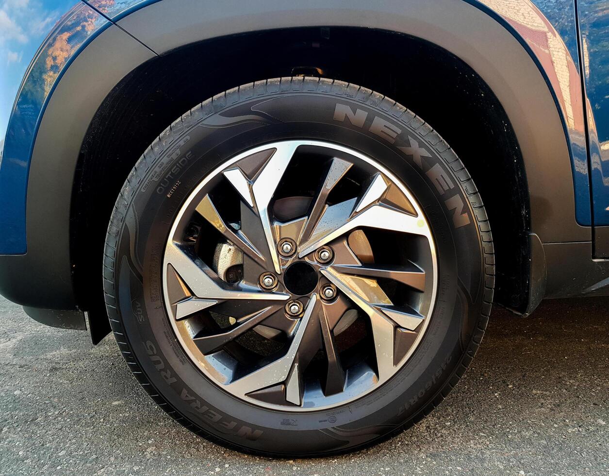 Grodno, Belarus - 09.27.2021 Close-up of a beautiful automobile alloy wheel with a nexen tire photo