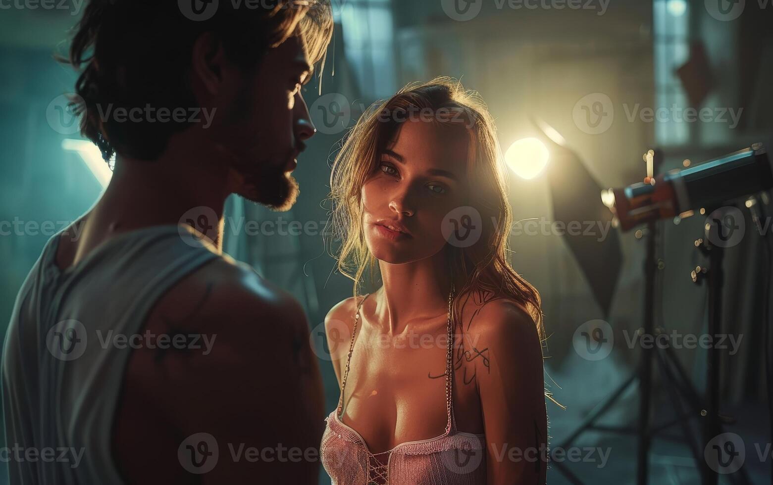 Young Woman Looking at Man During Studio Photography Session photo