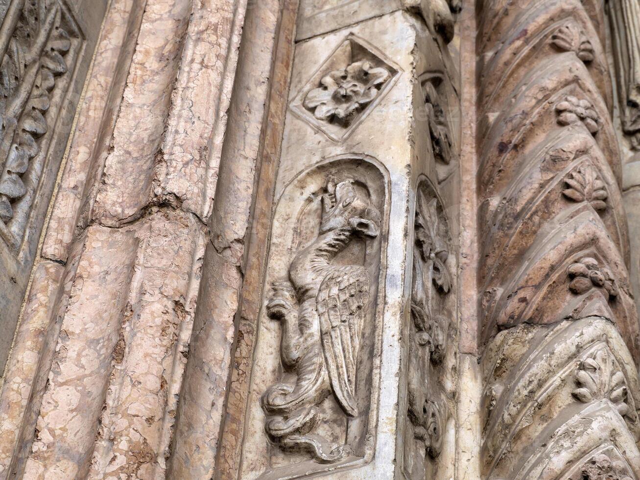 Verona dome cathedral church exterior sculptures detail. Romanesque sculpture attributed to the workshop of Veronese sculptor Brioloto photo