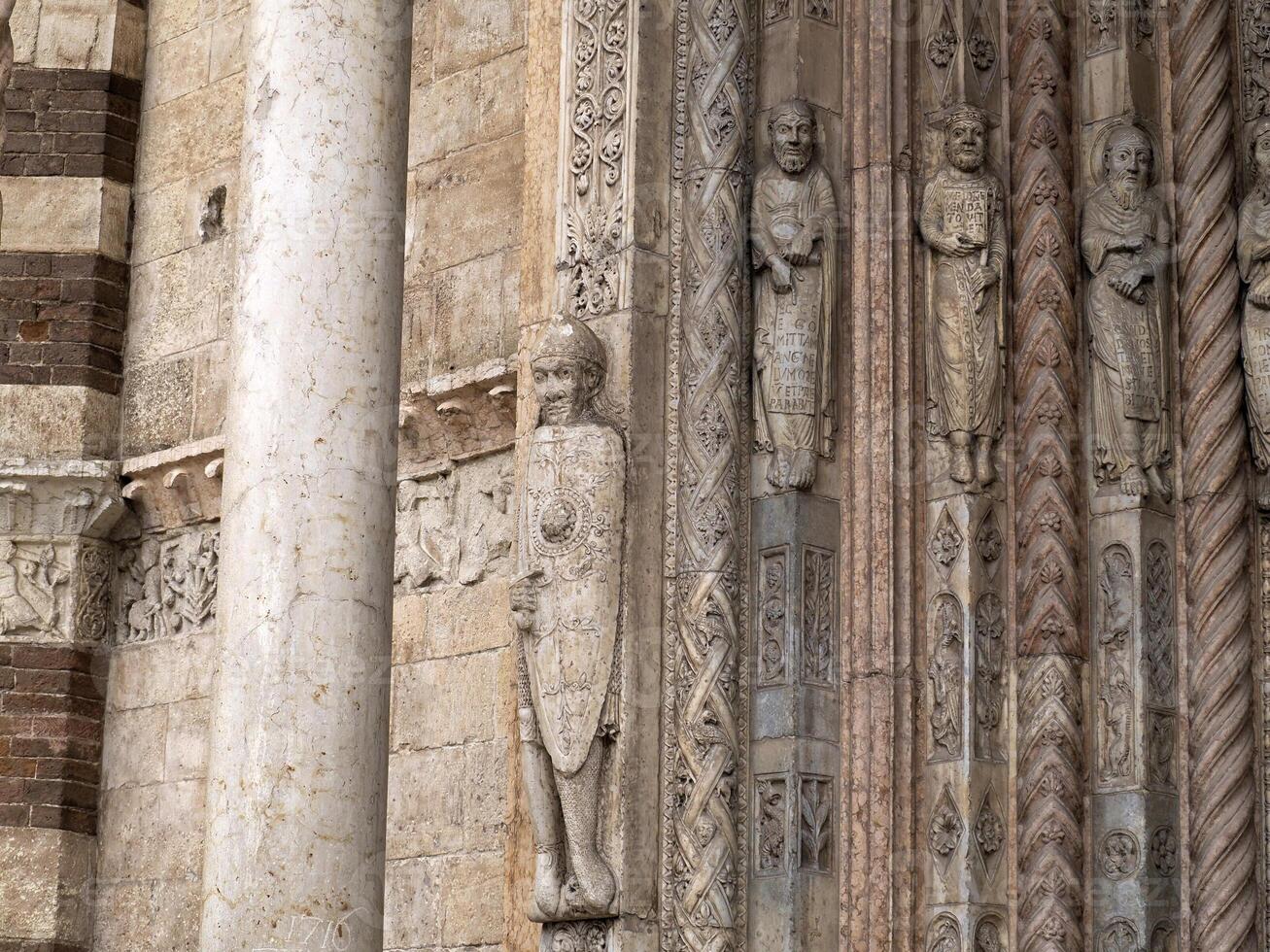 Verona dome cathedral church exterior sculptures detail. Romanesque sculpture attributed to the workshop of Veronese sculptor Brioloto photo