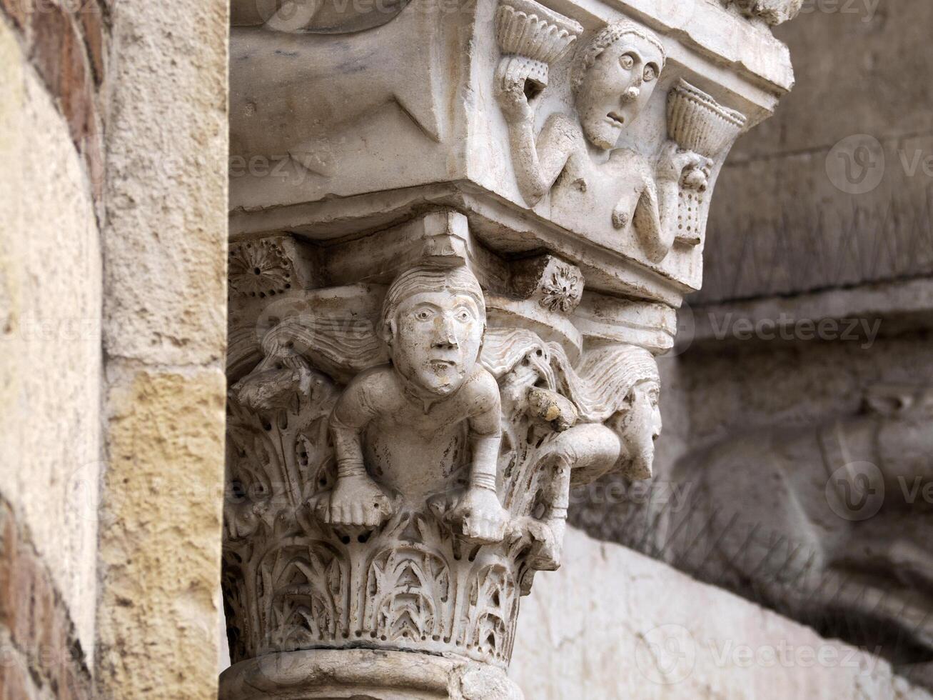 Verona dome cathedral church exterior sculptures detail. Romanesque sculpture attributed to the workshop of Veronese sculptor Brioloto photo