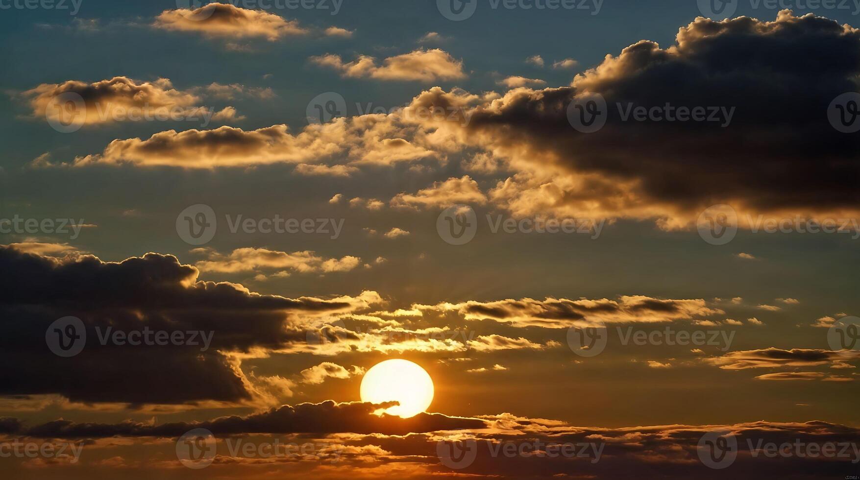 A bright sun behind clouds at sunset. photo