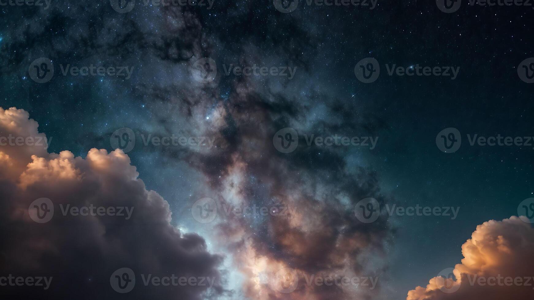 A night time sky with stars and the milky way behind some dramatic clouds. photo
