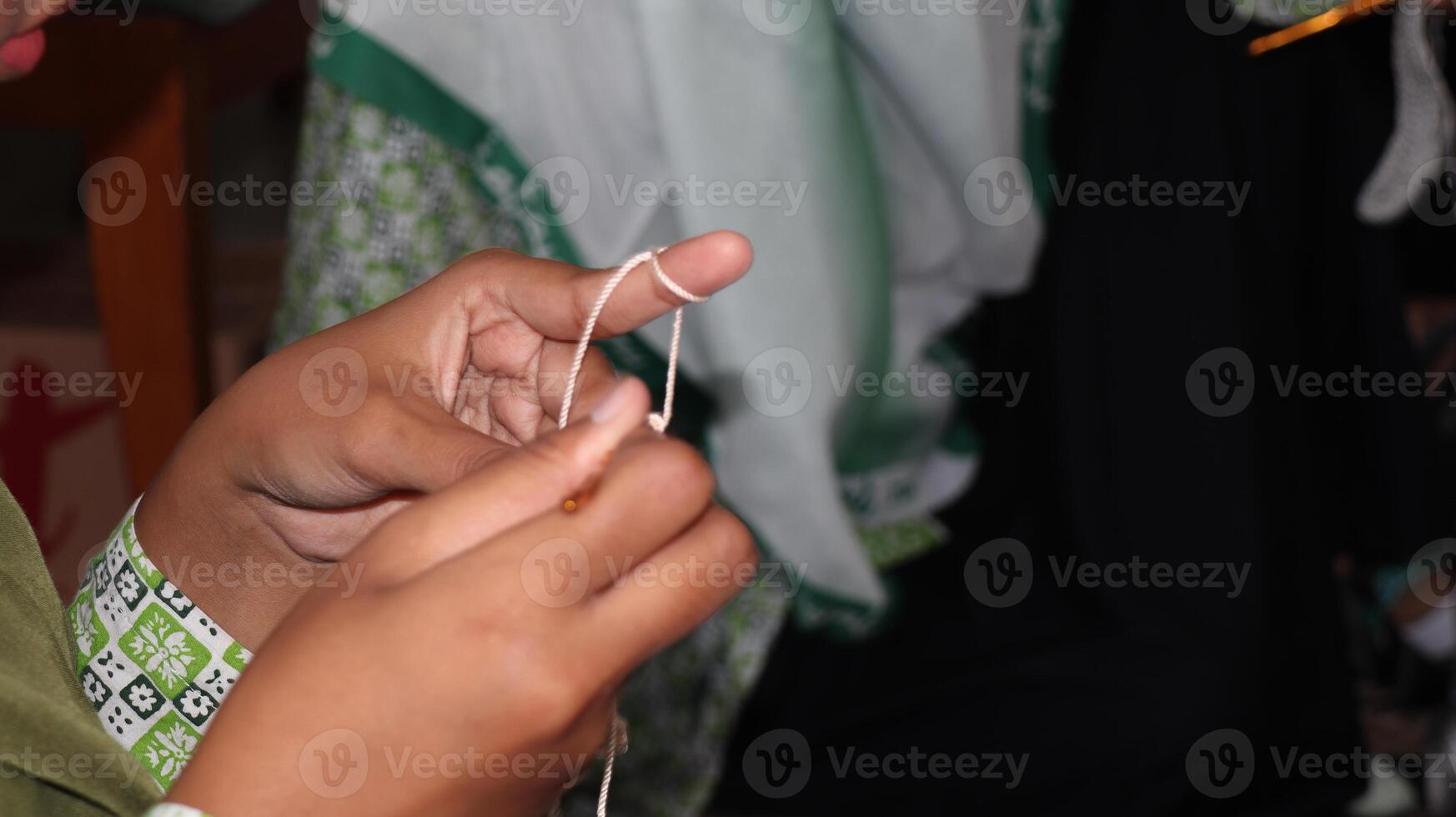 Female hands close-up. Handmade. Colored yarn and knitting needles. photo