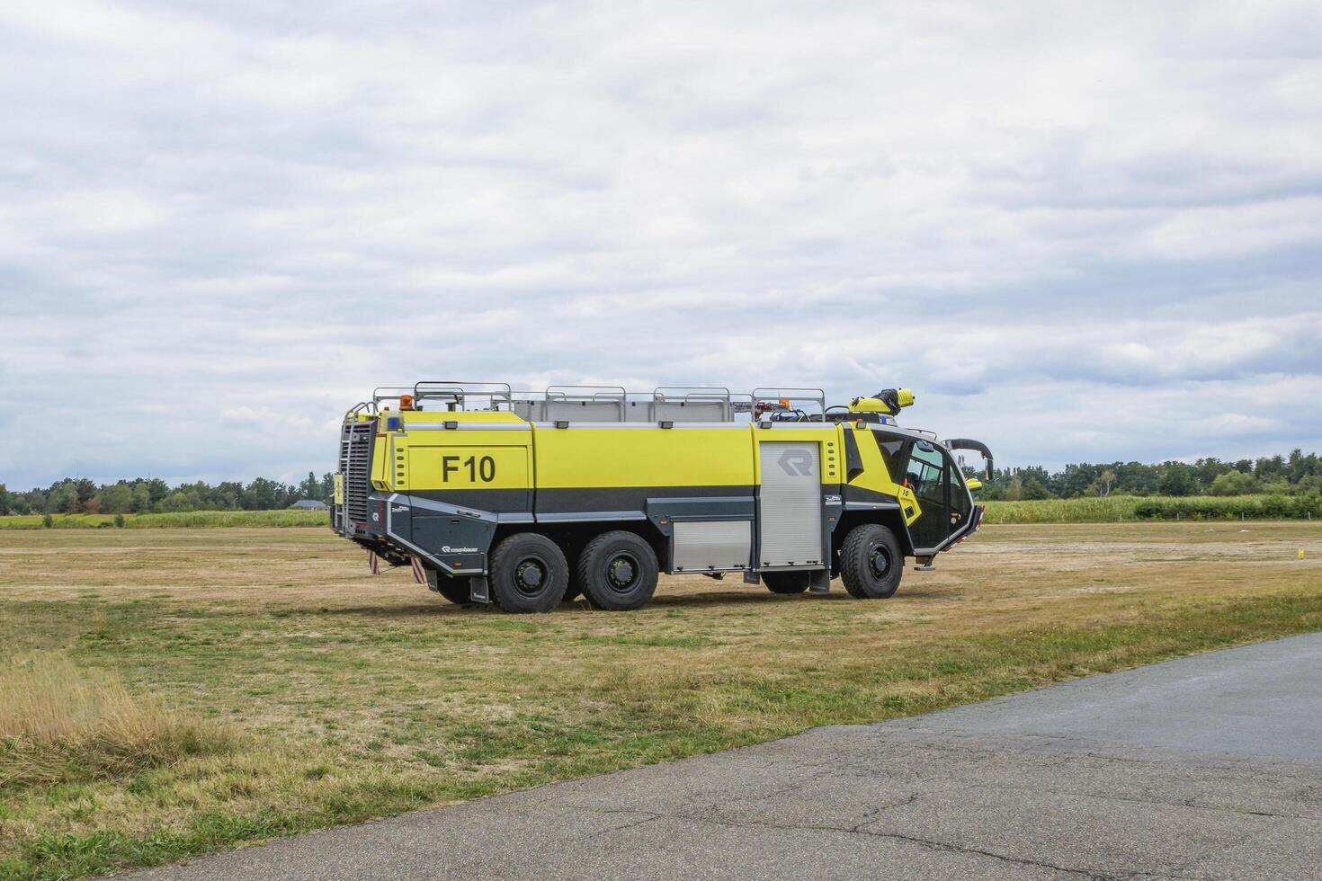 Hasselt. Limburg - Belgium 27-08-2022. Modern fire truck for use on airfields. Outdoor public show of vintage aircraft on the grass airfield at the Hasselt Aero Club photo