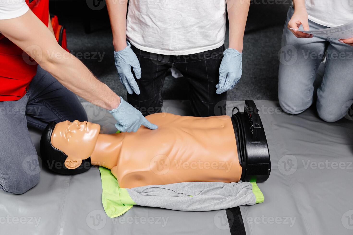 First Aid Training - Cardiopulmonary resuscitation. First aid course on cpr dummy. photo