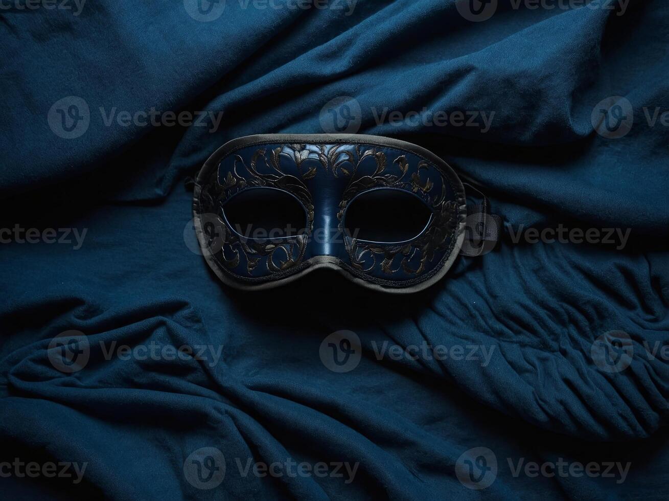 Sleep eye mask and blanket on dark blue background, top view Insomnia, fall asleep concept Flat lay, top view. photo