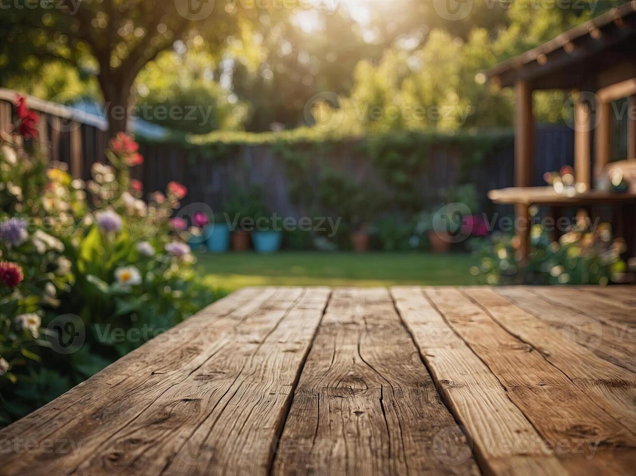 empty sturdy wooden table summer time blurred backyard garden background. photo