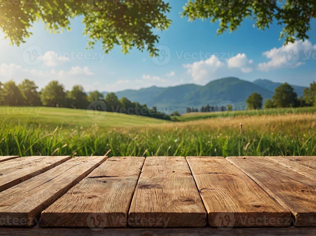 wooden table top product display with a fresh summer sunny blue sky with warm bokeh background with green grass meadow foreground. photo