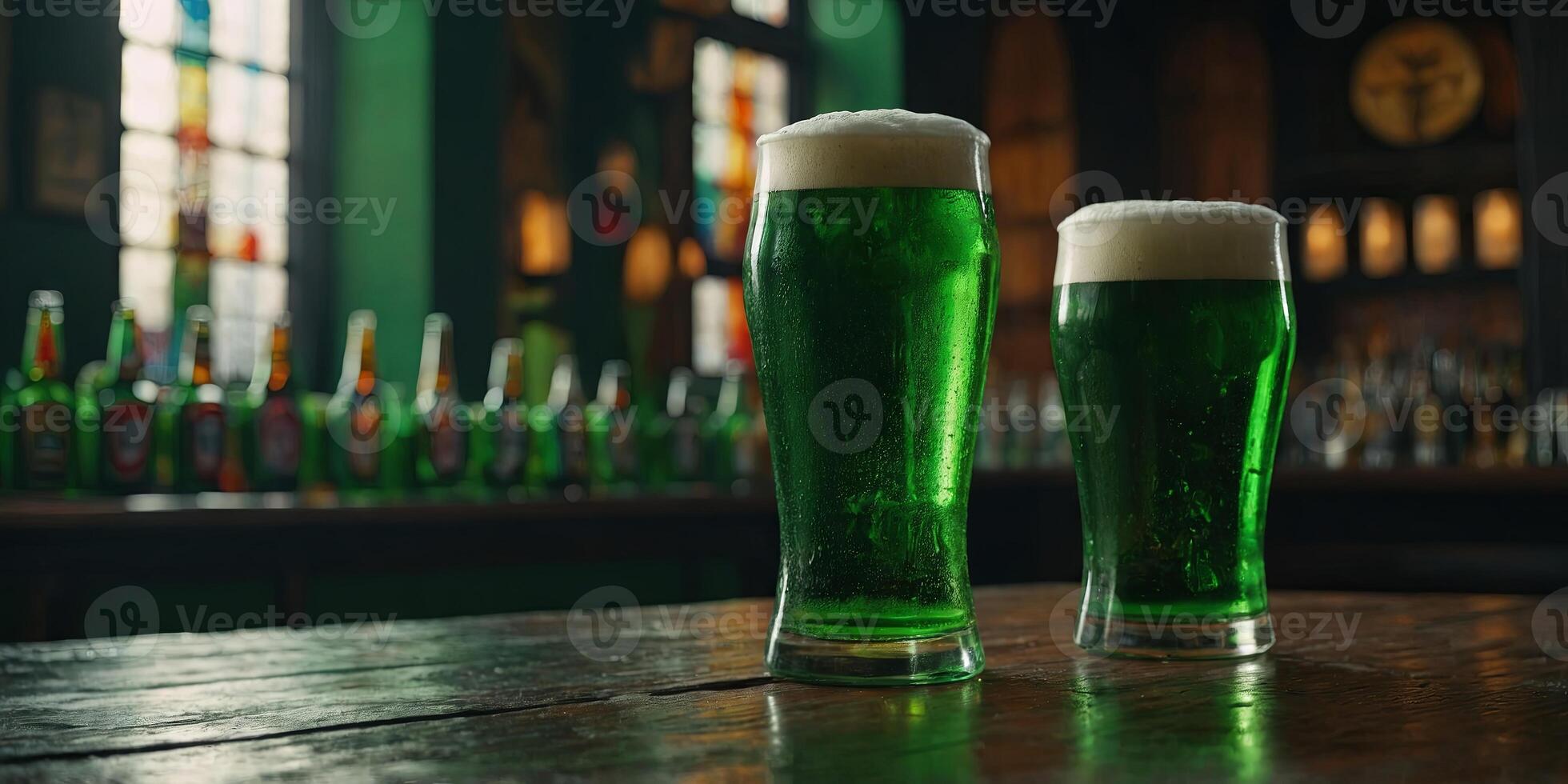 glass and bottle of green beer with foam on table, st patricks day concept. photo