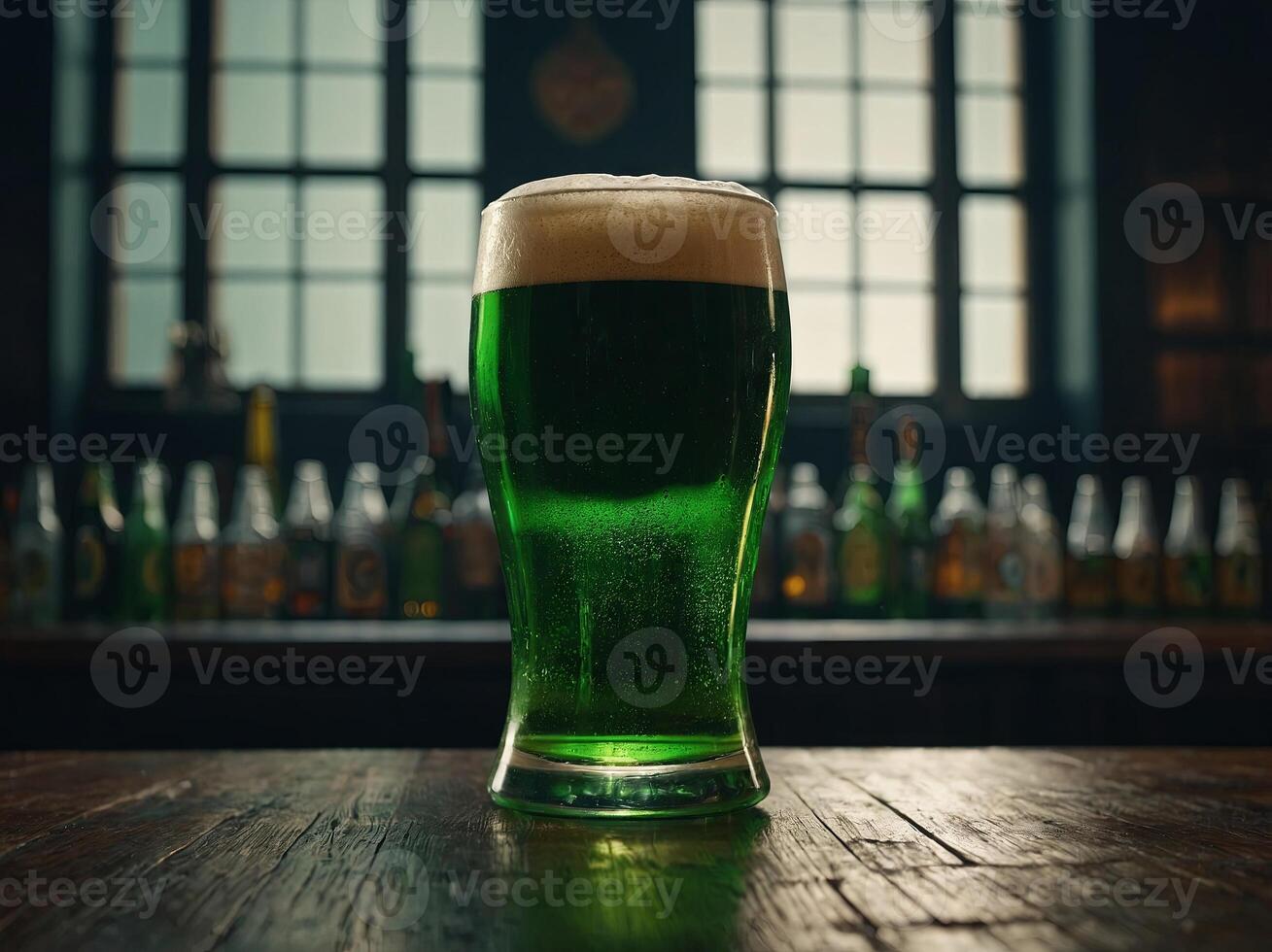 glass of green beer on table, st patricks day concept. photo