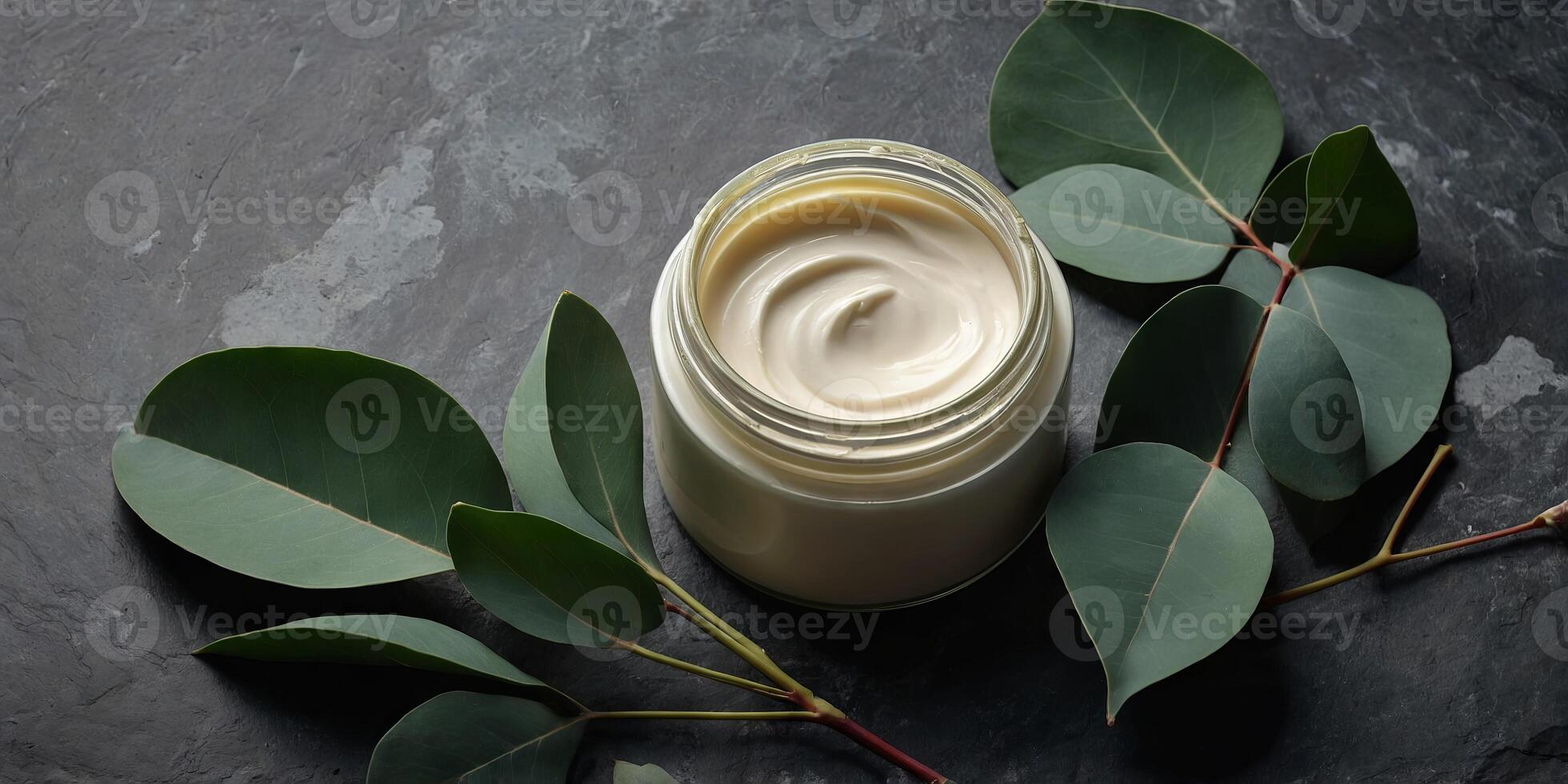 Jar of natural moisturizer cream with eucalyptus leaves on stone background Flat lay, top view, copy space Natural organic product, beauty and spa concept. photo