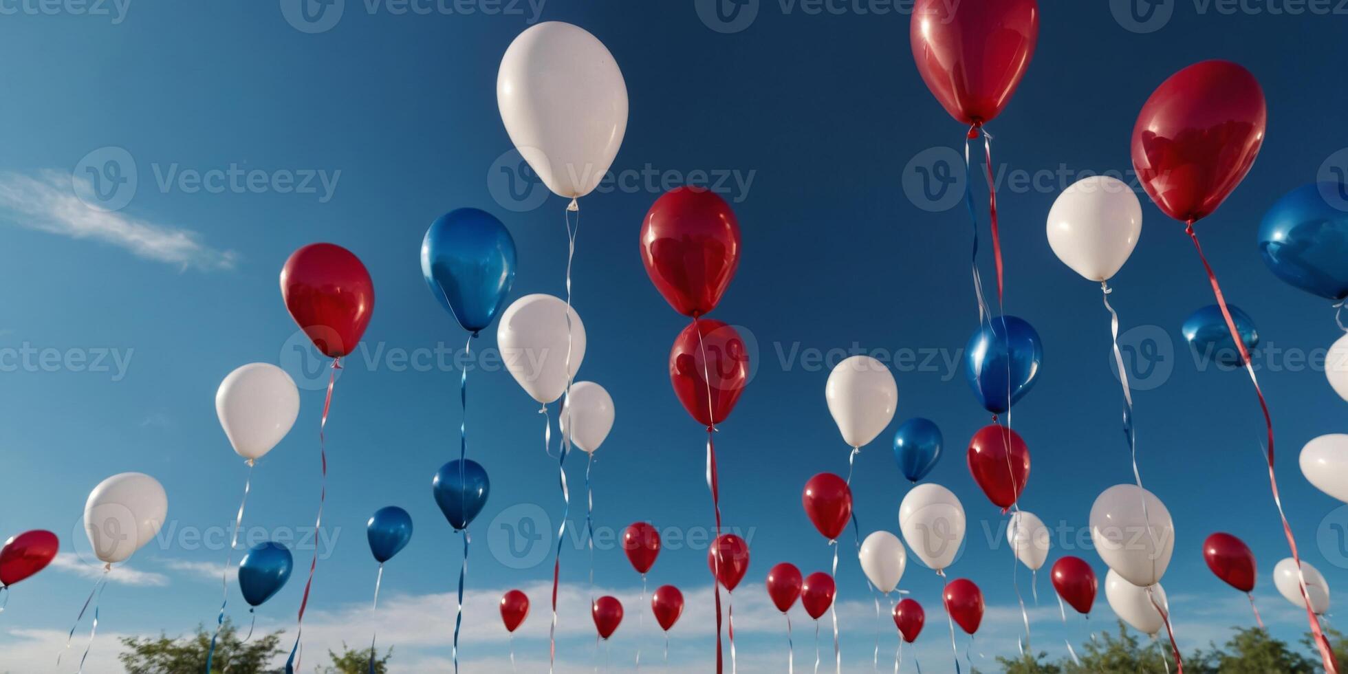 Red, white, and blue balloons with glossy finish floating under blue sky Memorial Day. photo