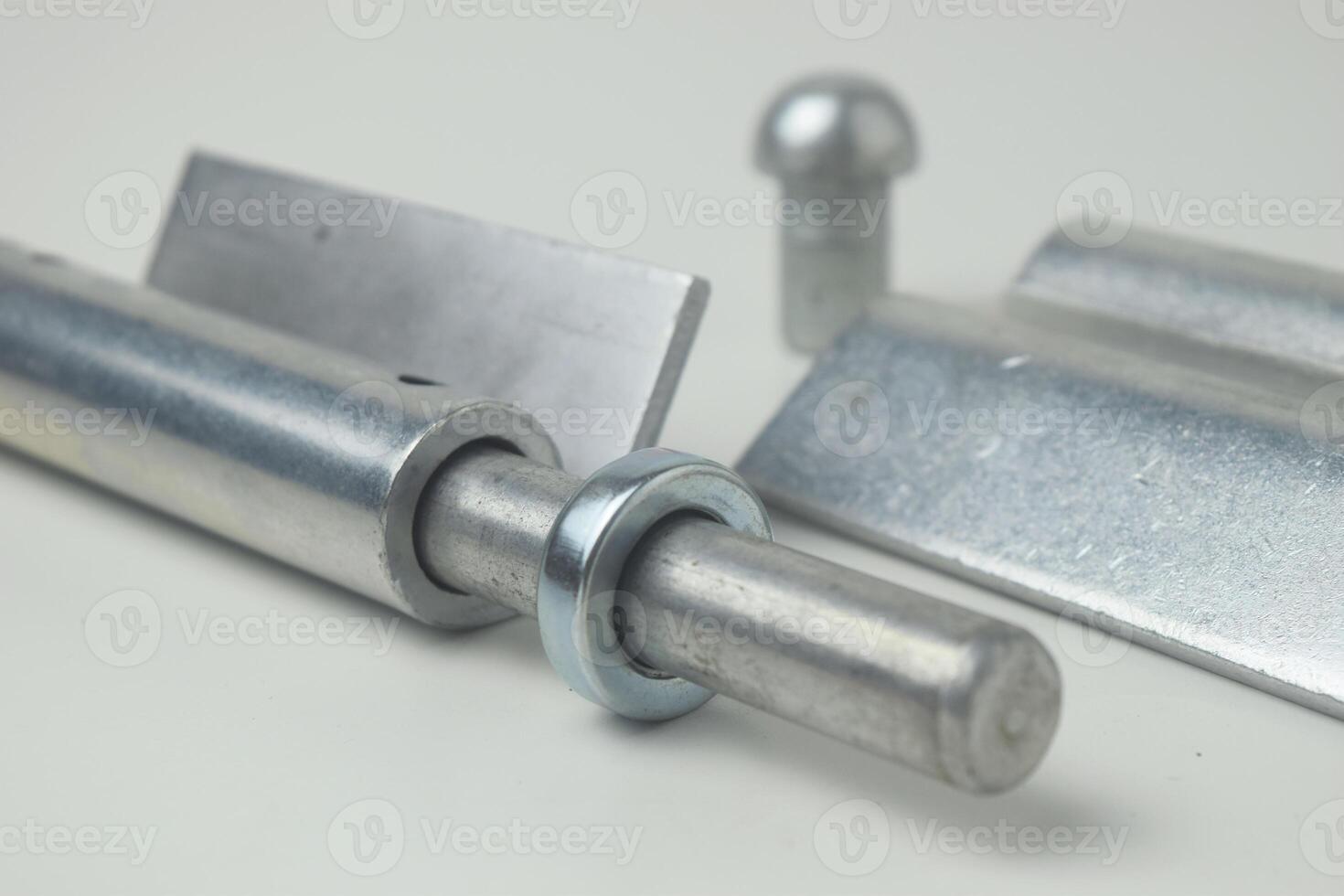 Closeup A fireproof iron hinge made in Indonesia with a white background photo