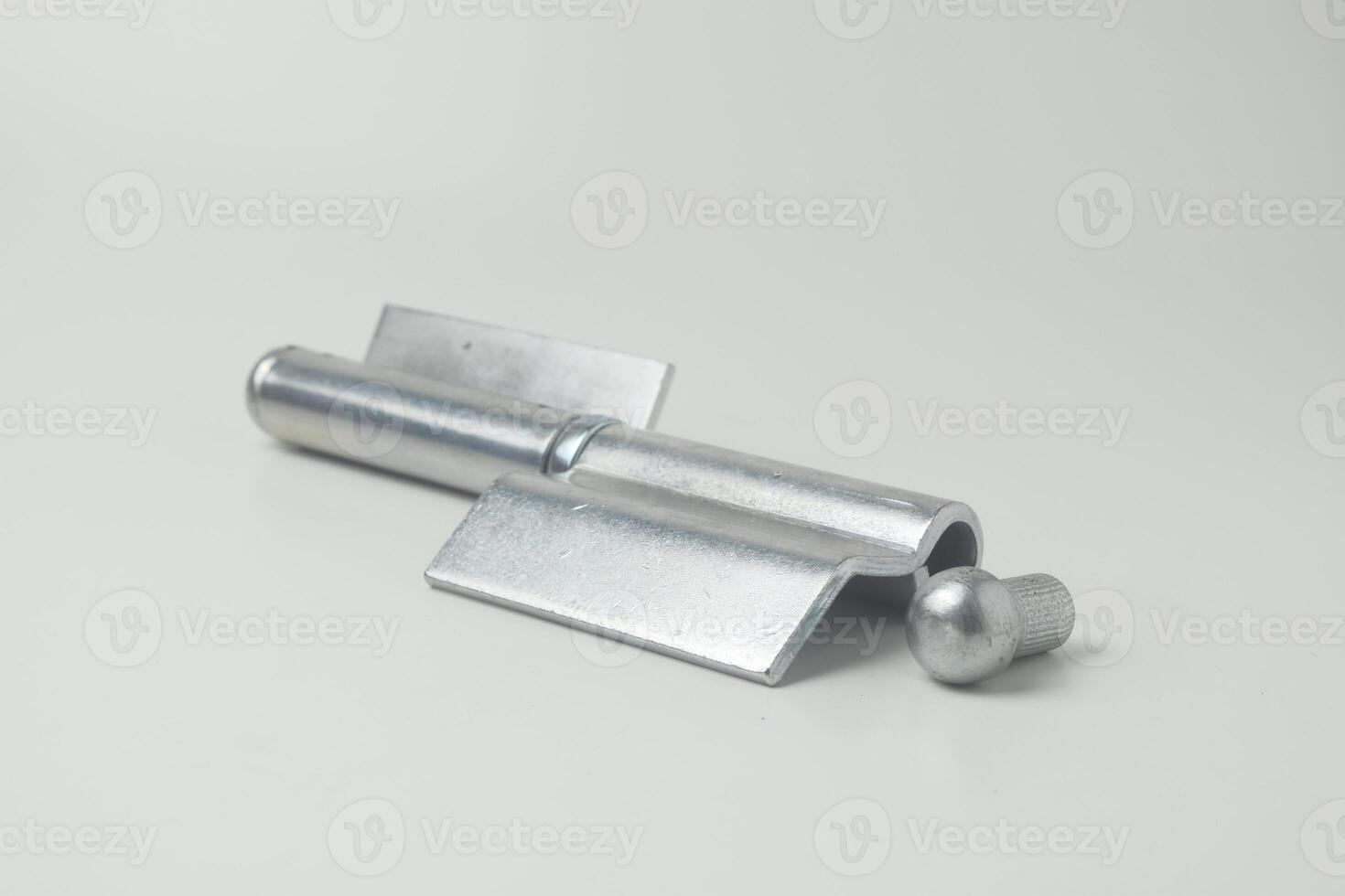 A fireproof iron hinge made in Indonesia with a white background photo