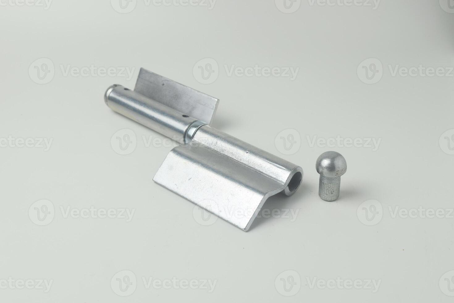A fireproof iron hinge made in Indonesia with a white background photo