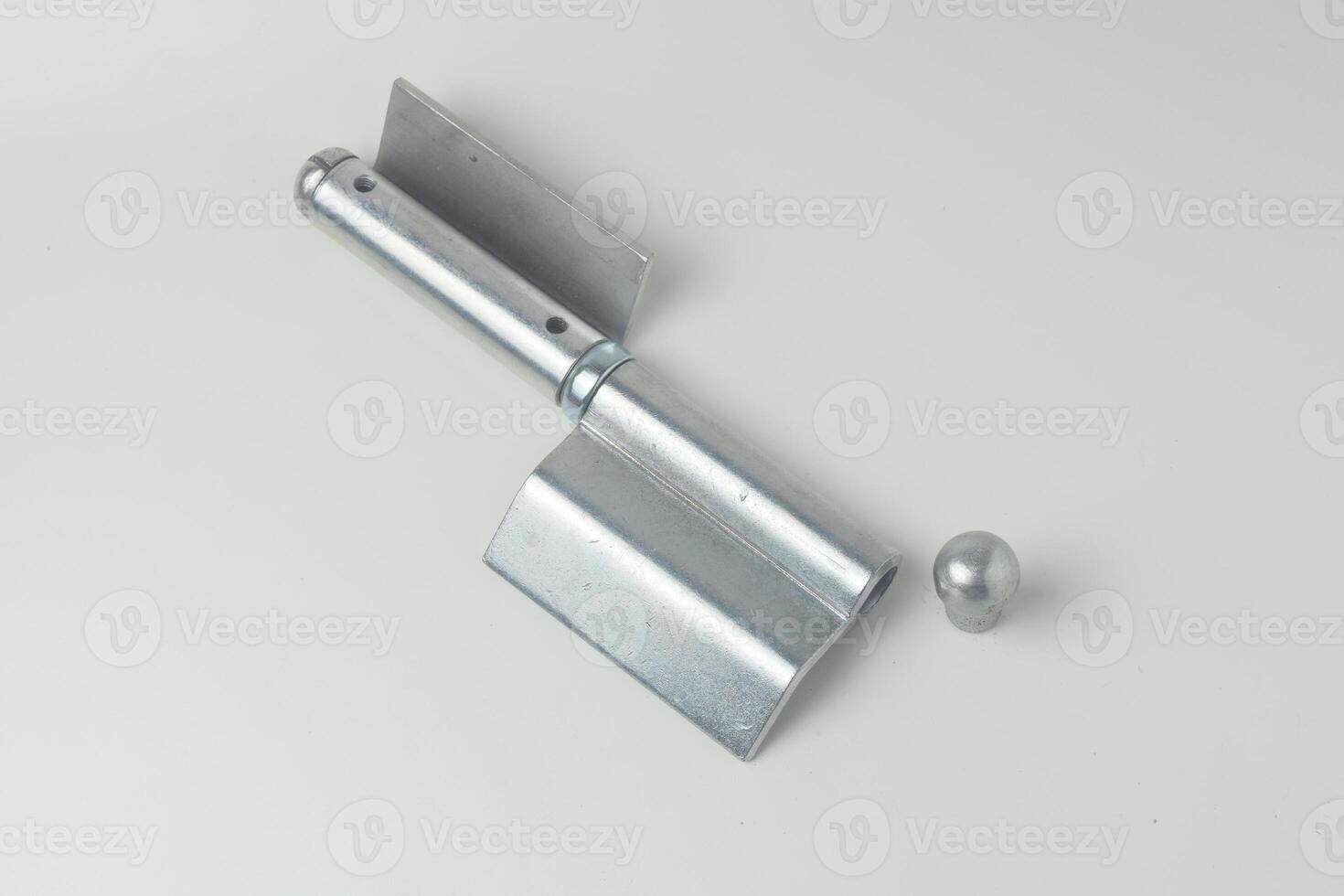 A fireproof iron hinge made in Indonesia with a white background photo